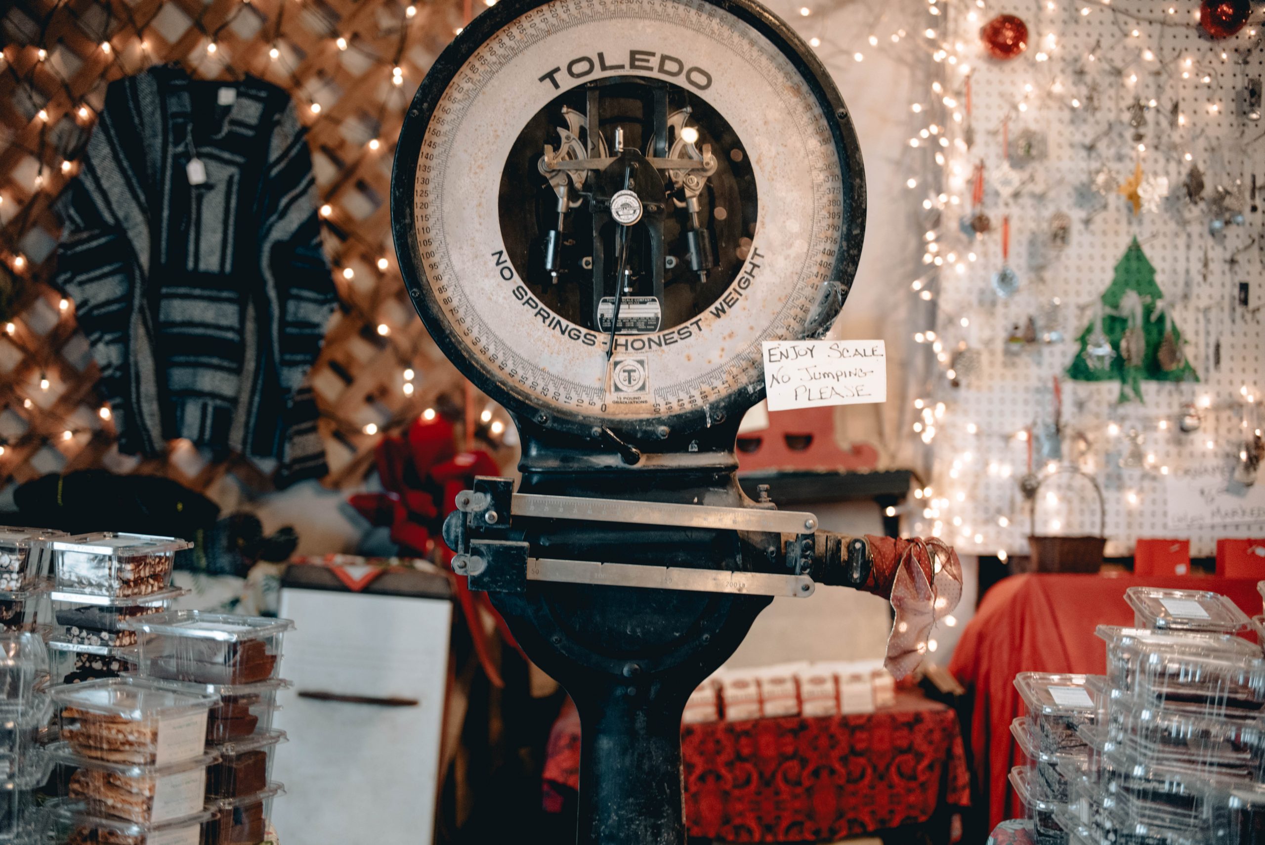 The vintage Toledo scale at the center of the Gift Barn, surrounded by ornaments and candy